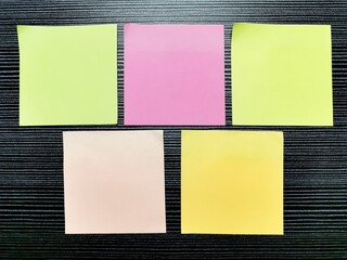 Colorful blank sticky notes on the table.