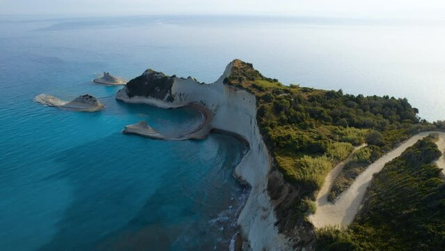 Drone Over Coastline Cliffs And Sea At Sunrise Of Cape Drastis