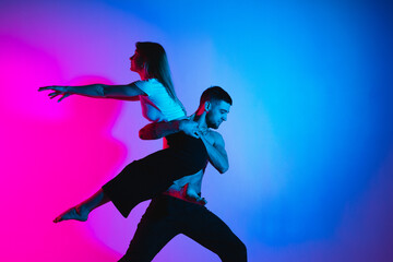 Gymnastics support. A man and a girl perform an acrobatic exercise