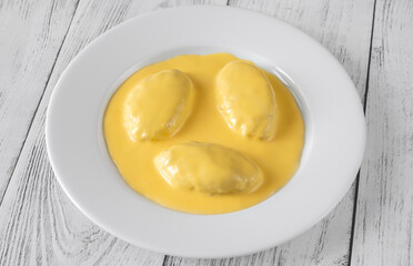 Quenelle with Hollandaise sauce