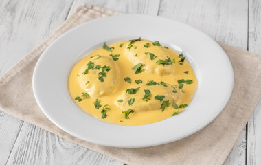 Quenelle with Hollandaise sauce