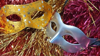 Carnival mask with colorful confetti.