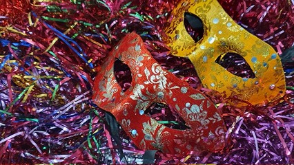 Carnival mask with colorful confetti.