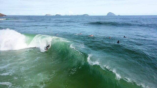 Drone view of people surfing at Sao Conrrado beach in Rio de Janeiro