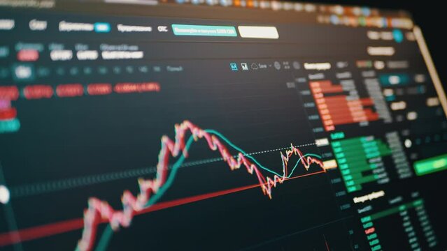 Trader Analyzes Candlestick Chart of Movement of Cryptocurrency on Screen PC. Online viewing of cryptocurrency quotes btc, eth chart in the application. Dynamics, statistics, stock exchange data.