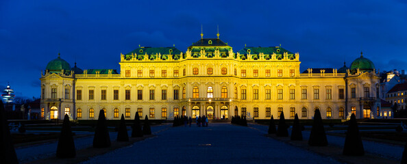 Illuminated Upper Palace in historical complex Belvedere at night, Vienna, Austria