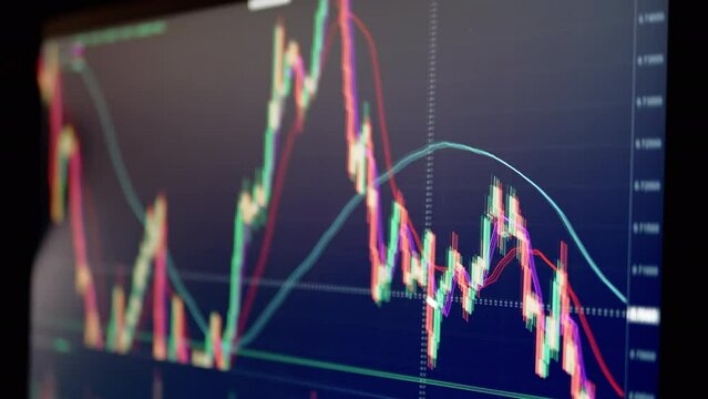 Trader Analyzes Candlestick Chart of Movement of Cryptocurrency on Screen PC. Online viewing of cryptocurrency quotes btc, eth chart in the application. Dynamics, statistics, stock exchange data.