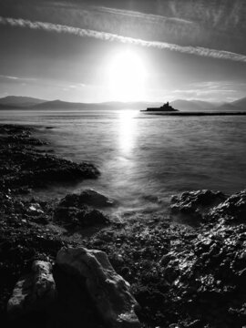 Fenit lighthouse shore at sunset