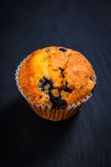 Muffins with Blueberries on Black Chalkboard with Copy Space. Selective focus.
