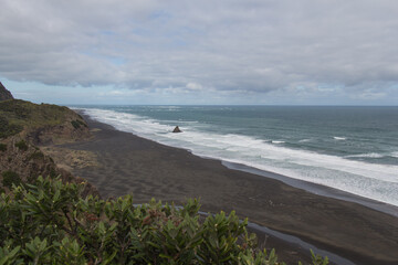 A small rocky outcrop at Karekare, a West Coast Beach near Auckland, New Zealand.