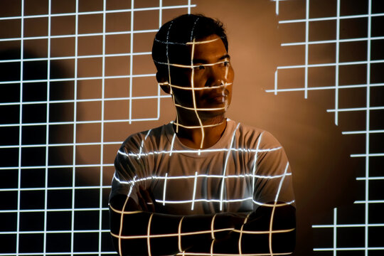 Light painting portrait, light drawing on projector beam exposure. Interesting and fantastic shooting in the studio