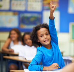 Pick me I know the answer. A little boy raising her hand in class. - obrazy, fototapety, plakaty