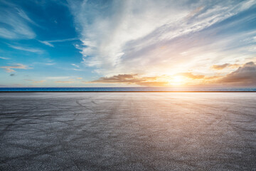Empty asphalt road and sea natural scenery at sunrise