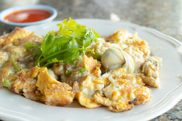 Crispy oyster omelette with chili sauce, Chinese seafood