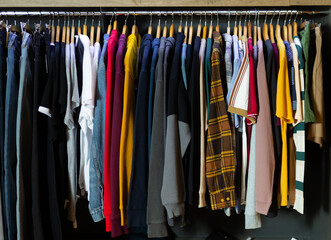 Close up of male shirts on hangers in clothing store