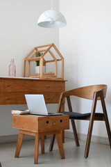 A minimal Scandinavian nordic portable home workspace with wooden furnitures