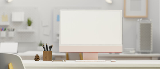 Comfortable office studio workspace with pastel pink pc computer