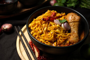 Khao Soi Kai, Tasty and spicy creamy yellow curry noodles with chicken