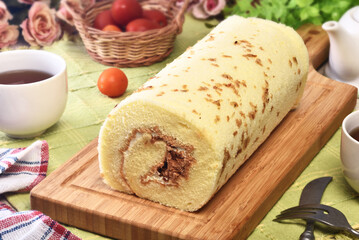 Salted roll cake stuffed with dried shredded pork and cream on the wooden cutting board