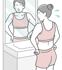 鏡の前で体型をチェックし、太った事に落ち込む若い女性