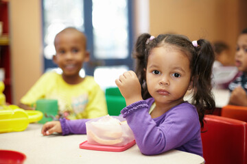 Getting some energy for the fun activites ahead. Pre-school children on their lunch break eating...