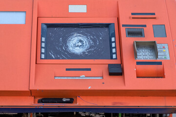 Vandalized and looted ATM. Destroyed automatic transaction machine. Consequences of demonstrations...