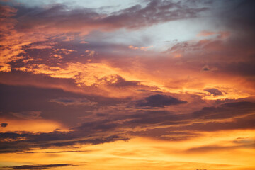 close up of sunset sky during golden hour with clouds