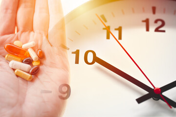 Time of day to take a drug multi-dose medication concept. various assorted medicine pills tablet...