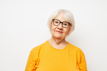 Photo of retired old lady vision problems with glasses light background