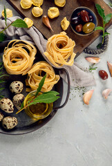 Italian pasta assortment on light background.