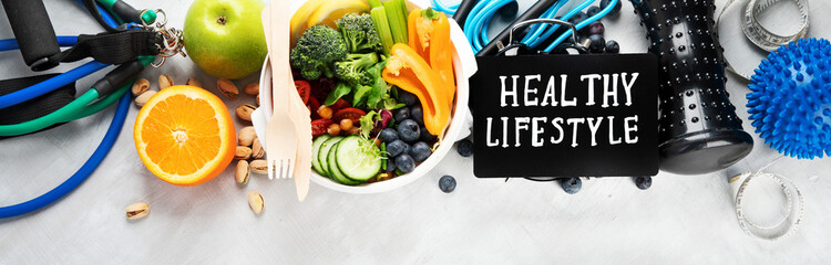 Healthy food and exercising equipment.