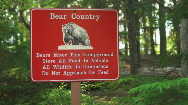 A Bear Country warning sign near a road inside Glacier National Park, Montana, U.S.A.Bear sightings in this area warning sign.