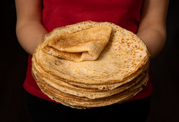 fresh baked pancakes in hands