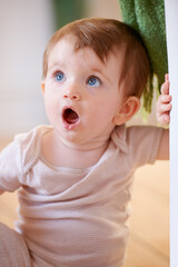 Shocked. An adorable little baby looking surprised.