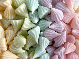 Allure candy traditional Thai dessert made from coconut milk, scented candle and pastel food color closeup textured background
