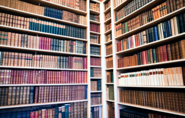 Blurred background of bookshelf full of books