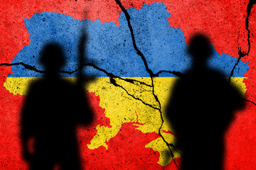 Flag of Ukraine painted on a concrete wall with russian soldiers. Relationship between Ukraine and...