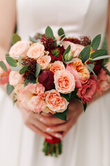 .Wedding bouquet in hands.