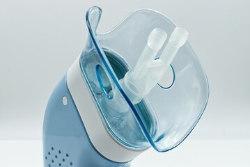 Portable compressor nebulizer with inhaler tool. Close-up. Medical equipment for inhalation...