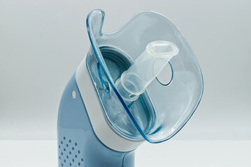 Portable compressor nebulizer with inhaler tool. Close-up. Medical equipment for inhalation...