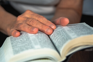 A woman is engaged in reading spiritual books.