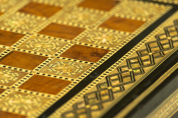 Carved board for chess and checkers.