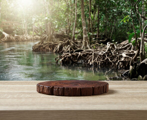 Wooden cuttingboard on table for standing product against nature landscape