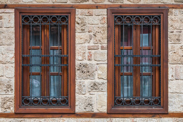 close-up of a beautiful black forged fence on a window in a city park