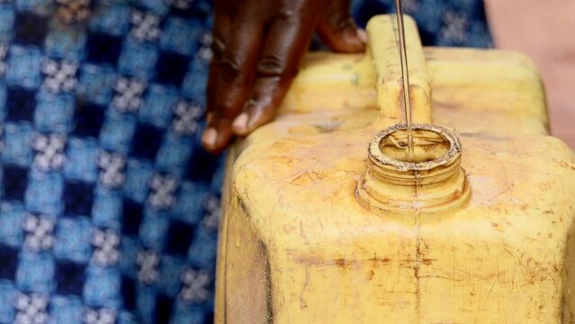 filling water jerrycan africa