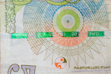 Plastic security strip on 50 GEL banknote. Security strip on Georgian lari banknote created to prevent counterfeiters.