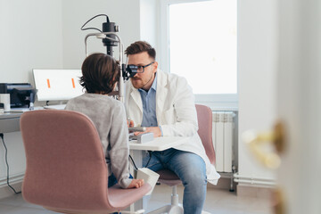 boy having eyesight test on clinic