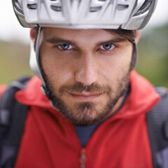 Can you handle the speed. Closeup portrait of a cyclist wearing a helmet.