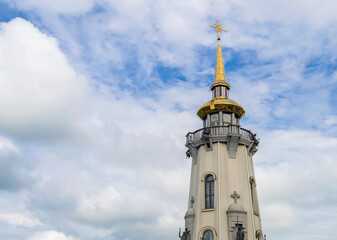 Christian church cross in high steeple tower for prayer