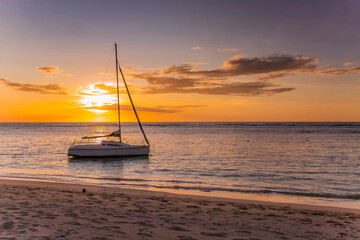 sail boat on the sea at sunset